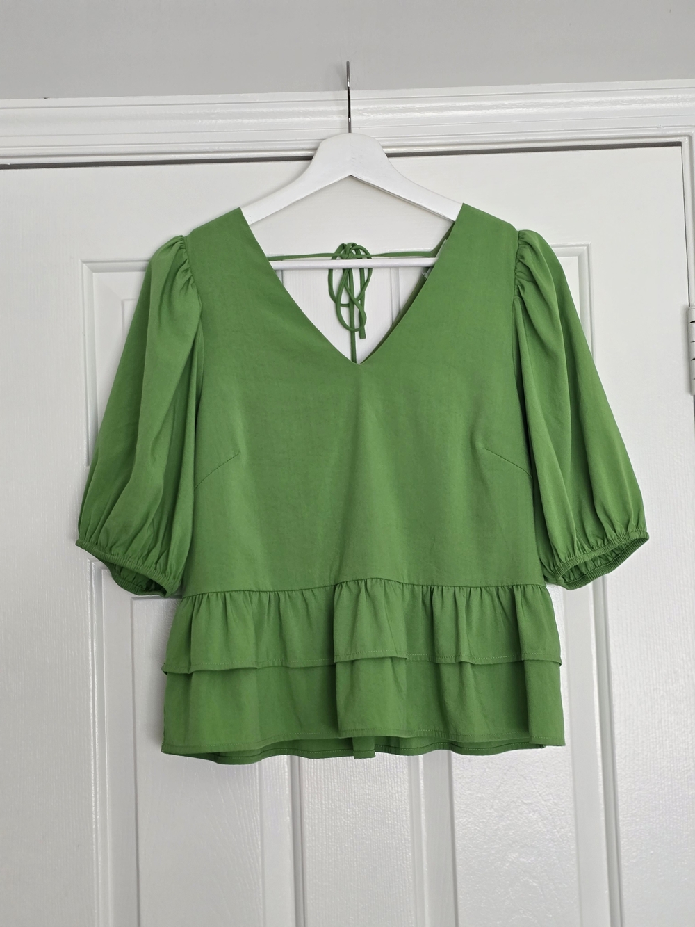 JADE by Melody Tam puff sleeve peplum top in a vibrant, unique shade of green